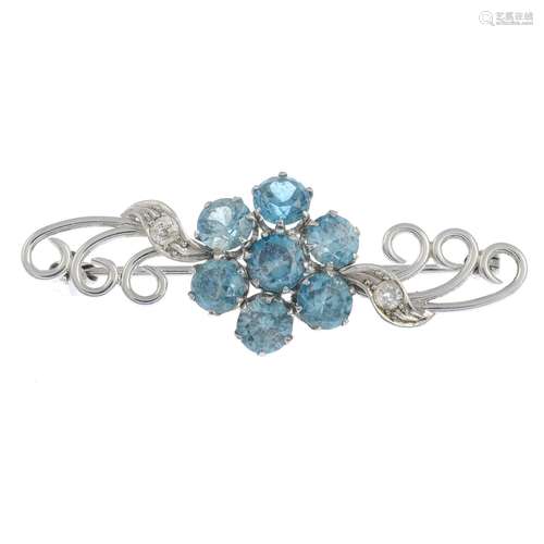 A mid 20th century platinum blue zircon and diamond floral brooch.Estimated total diamond weight