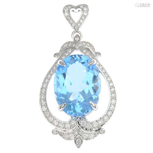 A topaz and diamond pendant.Topaz calculated weight 23.30cts,