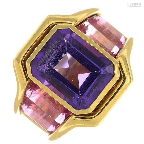 An amethyst and pink tourmaline dress ring.Amethyst calculated weight 4.19cts,