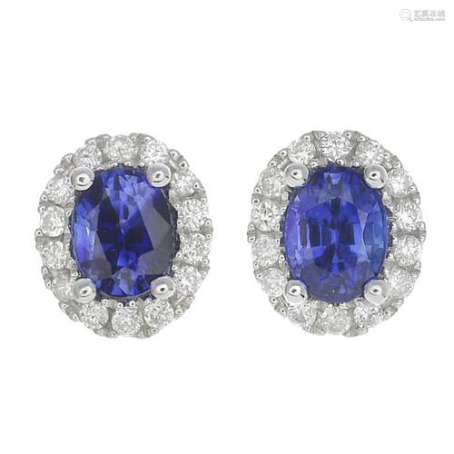 A pair of sapphire and diamond earrings.Sapphire weight 0.55ct.Total diamond weight 0.20ct,