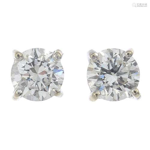 A pair of 18ct gold brilliant-cut diamond stud earrings.Estimated total diamond weight 0.60ct,