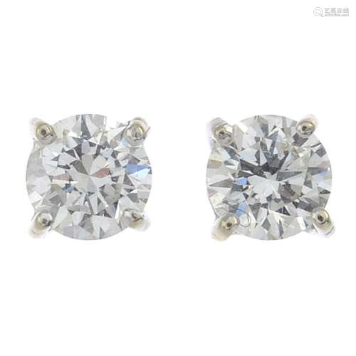 A pair of 18ct gold brilliant-cut diamond stud earrings.Estimated total diamond weight 0.60ct,