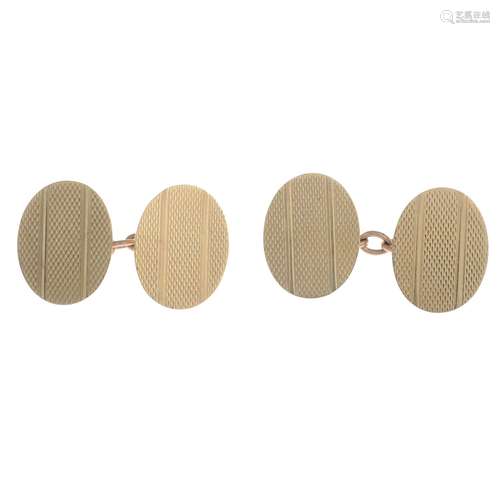 A pair of 9ct gold cufflinks.Hallmarks for London, 1971.Length of cufflink face 1.8cms.