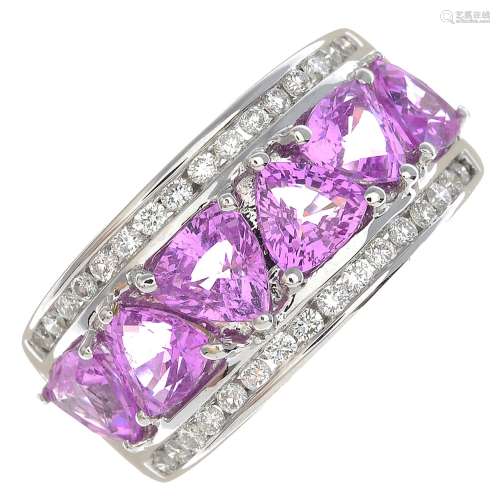 An 18ct gold pink sapphire and diamond dress ring.Total pink sapphire calculated weight 3.21cts,