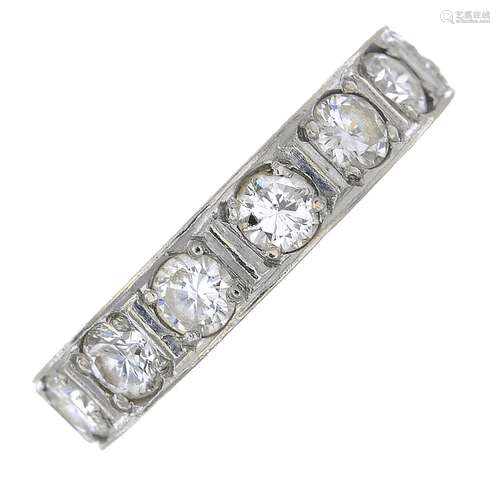 A mid 20th century platinum diamond full eternity ring.