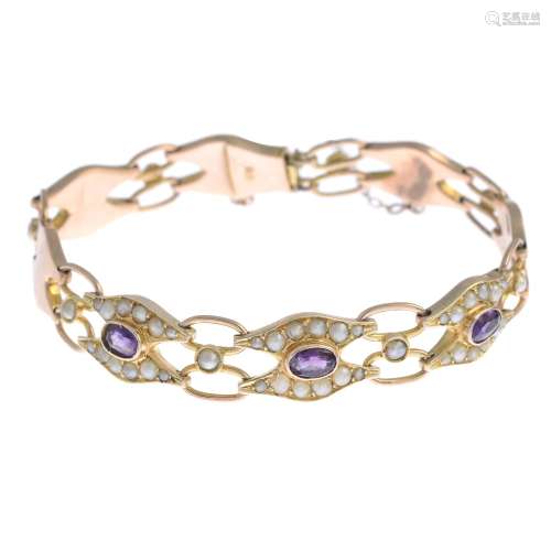 An early 20th century 9ct gold amethyst and split pearl bracelet.Stamped 9ct.Length 17.5cms.
