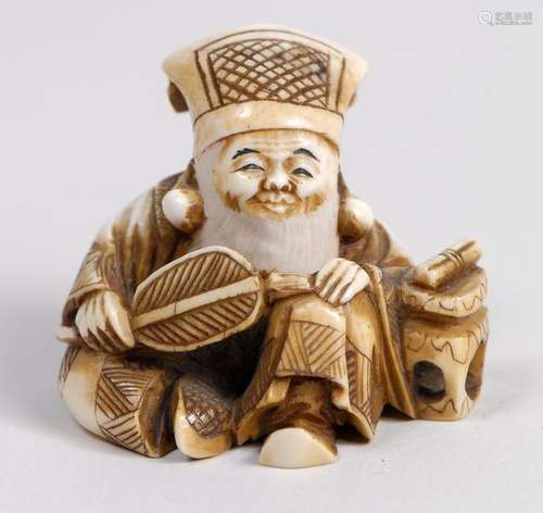 Netsuke en ivoire rehaussé de brun représentant un…