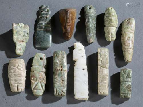 12 Carved Pre-Columbian style hardstone pendants.