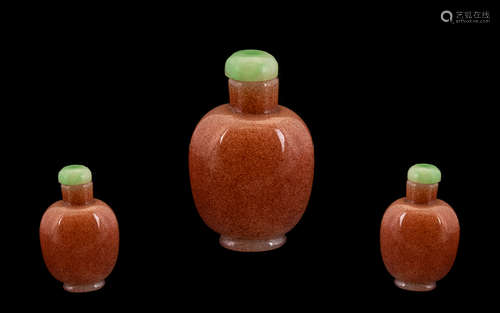 Chinese Pink Speckled Glass Snuff Bottle, with jade stopper, Plain Form Height 2.5 Inches.