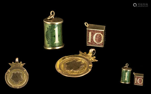 A Gold ' 10 Shillings ' Charm, A Gold ' 10 ' bob Charm and a Gold Blank '1902 ' Fob.