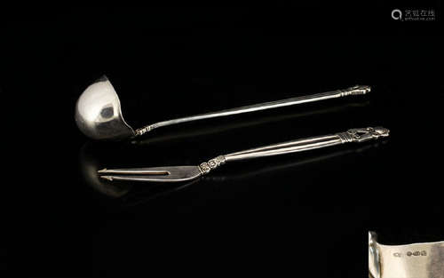 Georg Jensen, a Danish Silver Acorn Pattern Sauce Ladle And Pickle/Olive Fork. post 1945 stamped