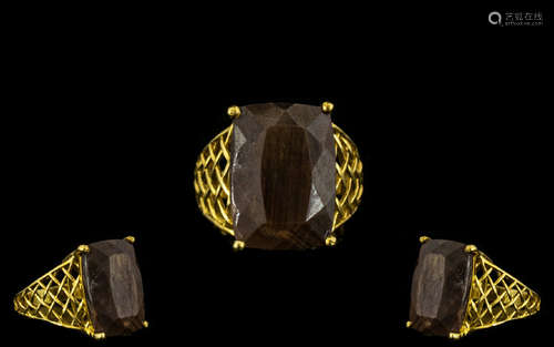 Golden Lustre Sapphire Statement Ring, a 22ct elongated cushion cut solitaire of the rare variety,