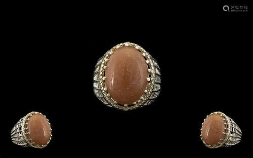 Peach Sunstone Solitaire Statement Ring, a 16ct oval cut cabochon of the sunstone, the soft peach