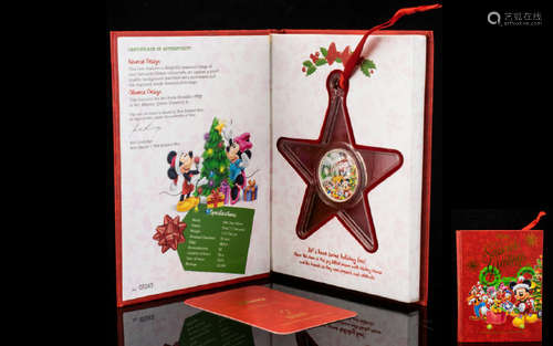 Disney Christmas Decoration Limited Edition 1/2 oz Silver Coin in red collector's book. 999 Fine