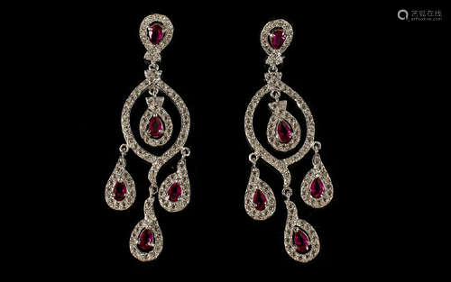 Faux Ruby and Diamond Chandelier Earrings, the pear cut faux rubies being the feature stones on a