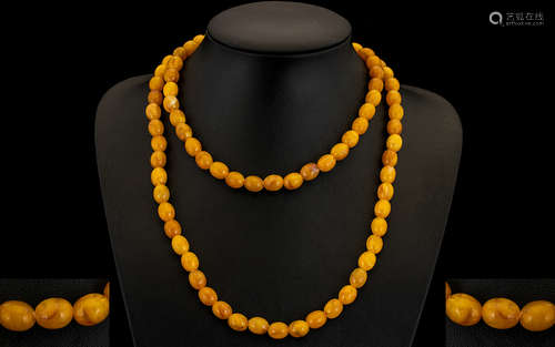 A Fine Quality Early 20thC Butterscotch Amber Beaded Long Necklace of Great Colour - Weight 56.2