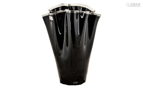 A Large Black Glass Handkerchief Vase finished in a high gloss sheen and measuring 21 inches in