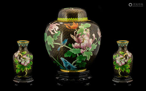 A Chinese Cloisonné Ginger Jar in a squat, baluster form festooned with a design of colourful