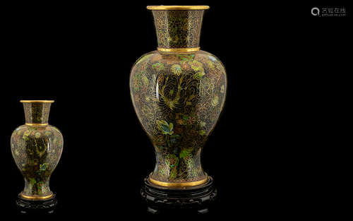 A Tall Cloisonne Vase of tapering form. The Vase is decorated in a combination of brown and green