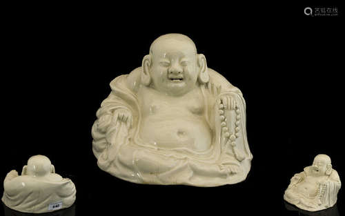 Chinese Sitting Buddha. Antique Chinese Buddha in off white porcelain, age related crazing, 5 inches