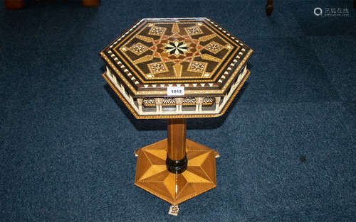 A Small Italian Occasional Table with parquetry inlay and North African design frieze modelled in an