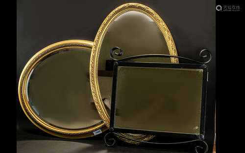 A Collection of Three Mirrors - to include 2 oval gilt mirrors, 1 square metal mirror with two black