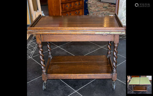 Early 20th Century Oak Trolley with swivel top with green felt card table on the reverse. Mounted on