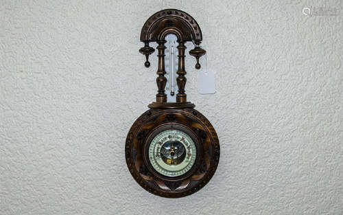 1920's Well Carved - Nice Quality Walnut Cased Wall Hanging Android Barometer with Porcelain Chapter