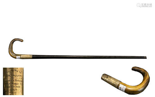 A Early 20thC Walking Cane with a horn handle and gilt ferrule with engraved presentation and