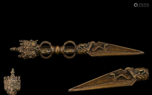 Tibetan Bronze Phurba The triform blade clasped by a dragon head, the vajra handle surmounted by a