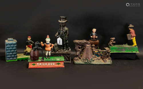 Collection Of Six Modern Cast Iron Money Banks, To Include Magician Bank, Uncle Sam, Artillery bank,