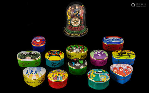 Collection of Beatles Music Boxes by Franklin Mint. Porcelain music boxes with lids, representing