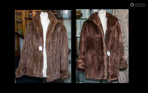 Two Ladies Medium Brown Fur Coats comprising one mink, one musquash. Both fully lined, with slit