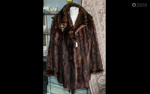 Ladies Mink Jacket. Hip length, hook and eye fastening, two slit pockets, revere collar and long