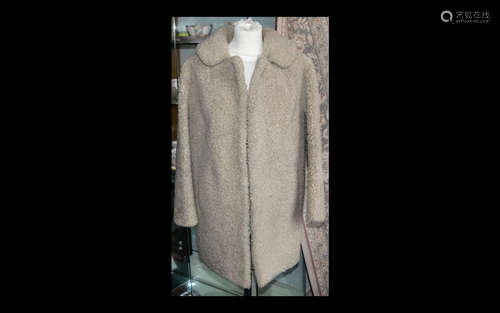 Ladies Curly Cream Lambs Wool Jacket. Three quarter length, long sleeves, hook and eye fastening,