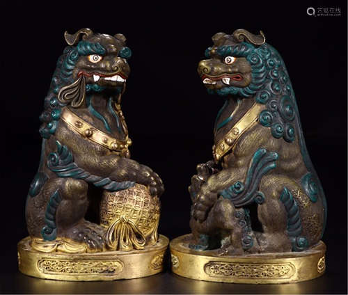 PAIR OF CHINESE GILT BRONZE COLOR PAINTED LIONS TABLE ITEM