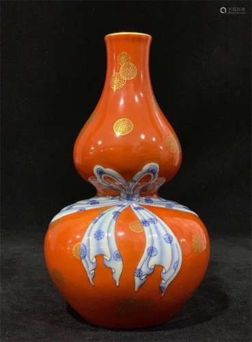 A Chinese Iron-Red Ground Famille-Rose Porcelain Double Gourd Vase