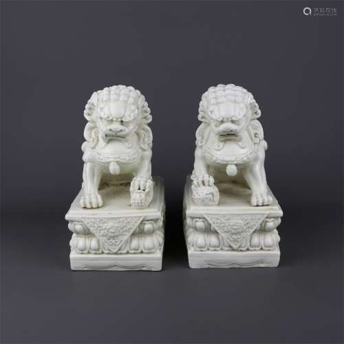 A Pair of Chinese Dehua Glazed Porcelain Foo-Dogs