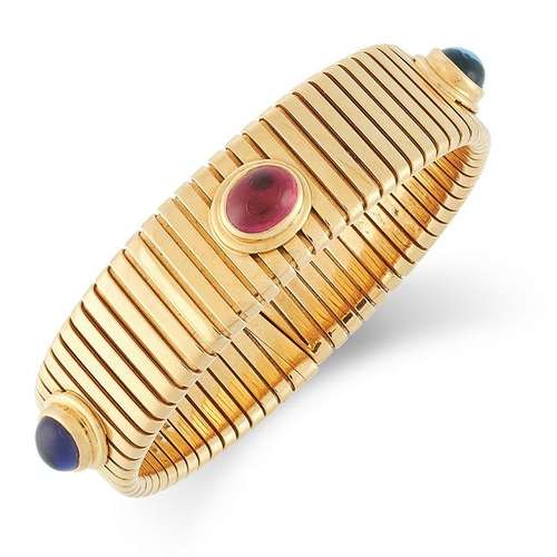 A GEMSET TUBOGAS BRACELET, BULGARI set with a cabochon