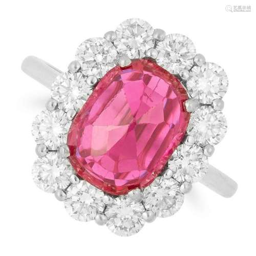 RUBY AND DIAMOND CLUSTER RING set with an oval faceted