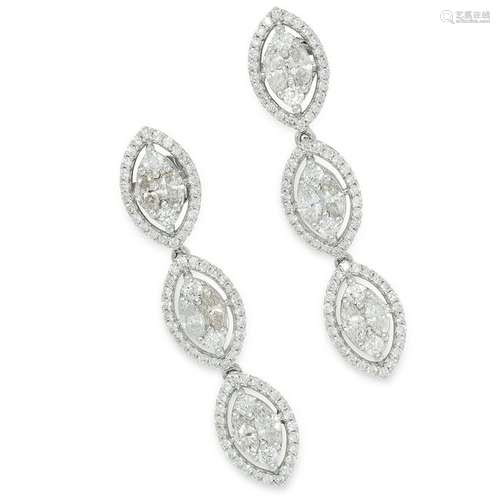 A PAIR OF DIAMOND EARRINGS each formed of a trio of