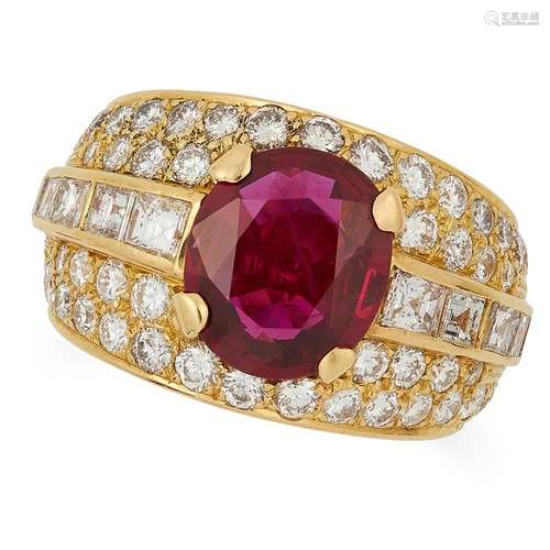 A RUBY AND DIAMOND RING set with an oval cut ruby of