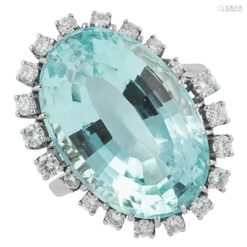 AQUAMARINE AND DIAMOND CLUSTER RING set with an oval