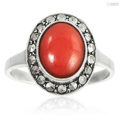 TWO CORAL AND MARCASITE RINGS each set with polished