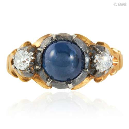 A SAPPHIRE AND DIAMOND RING set with a cabochon