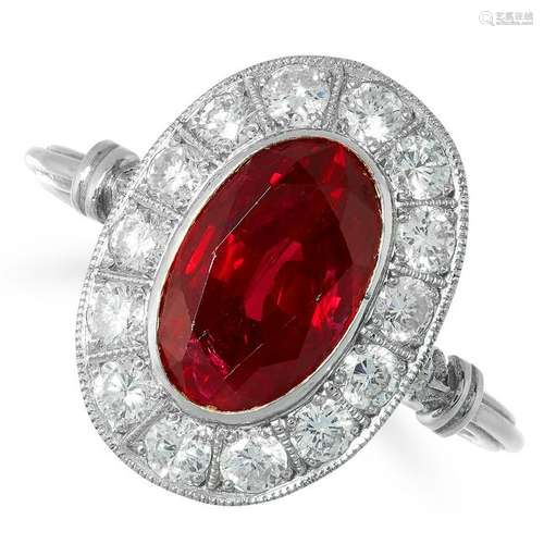 A RUBY AND DIAMOND CLUSTER RING, set with an oval cut