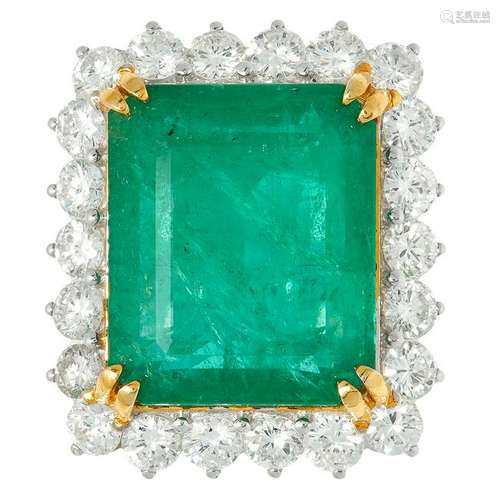 A 22.37 CARAT EMERALD AND DIAMOND CLUSTER RING