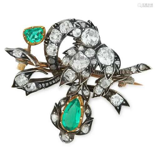 AN ANTIQUE EMERALD AND DIAMOND BROOCH in foliate design