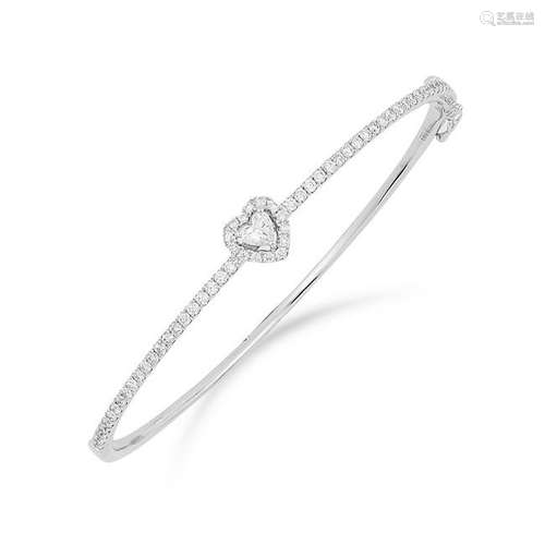 DIAMOND BANGLE set with a heart cut diamond in a border