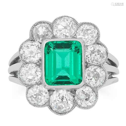 A COLOMBIAN EMERALD AND DIAMOND CLUSTER RING set with